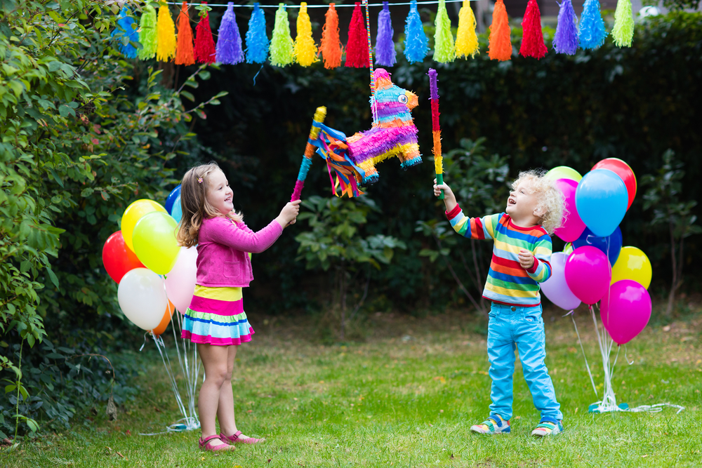 Kids playing with birthday pinata - Dublin OH Preschool | Polaris OH Preschool